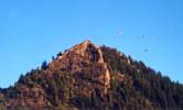 Parasailers above Aspen cliff
